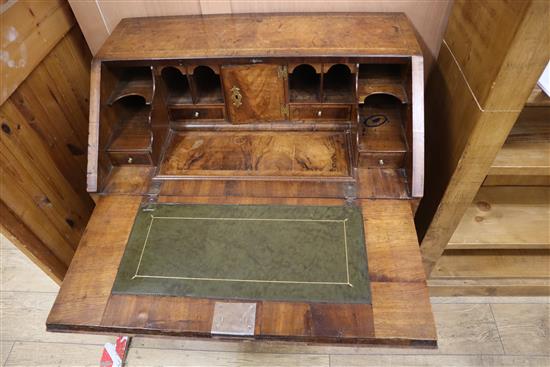 An early 18th century herringbone crossbanded walnut bureau (a.f.) W.76cm